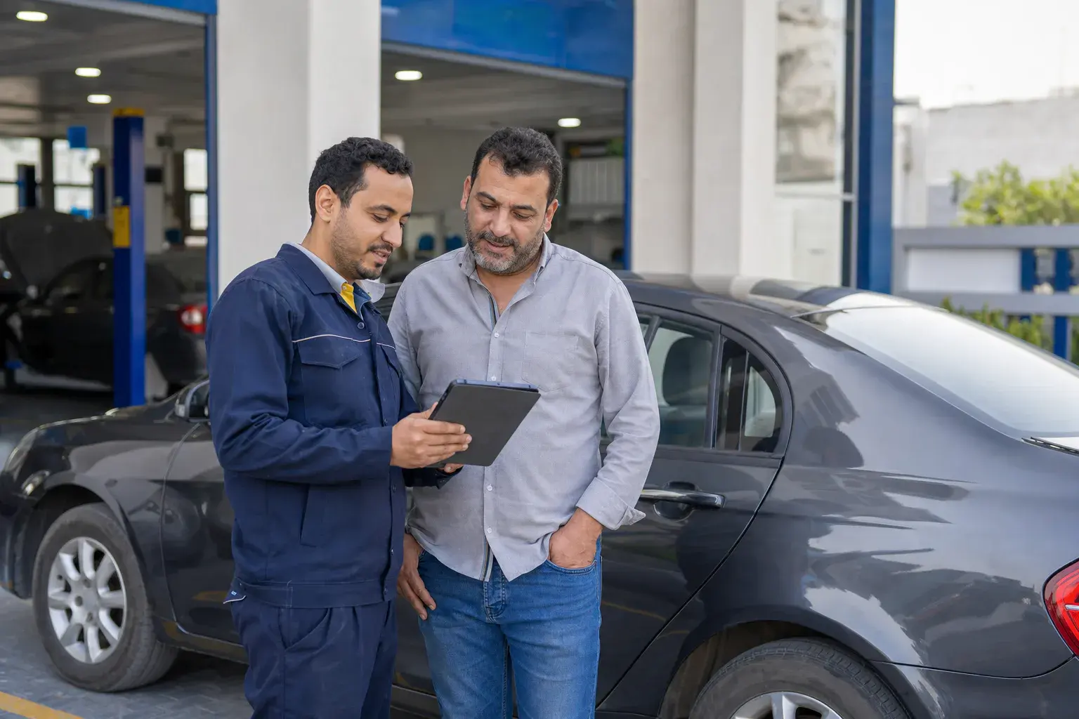 Service advisor reviewing the completed inspection with a customer